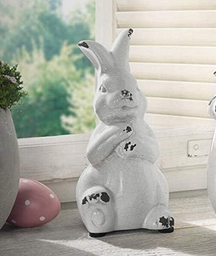 Керамички бел зајаче зајачки статуа фигура Велигденска пролетна декорација антички гроздобер со потресена рустикална зајаче фигура